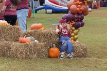 scarecrow on hay bale